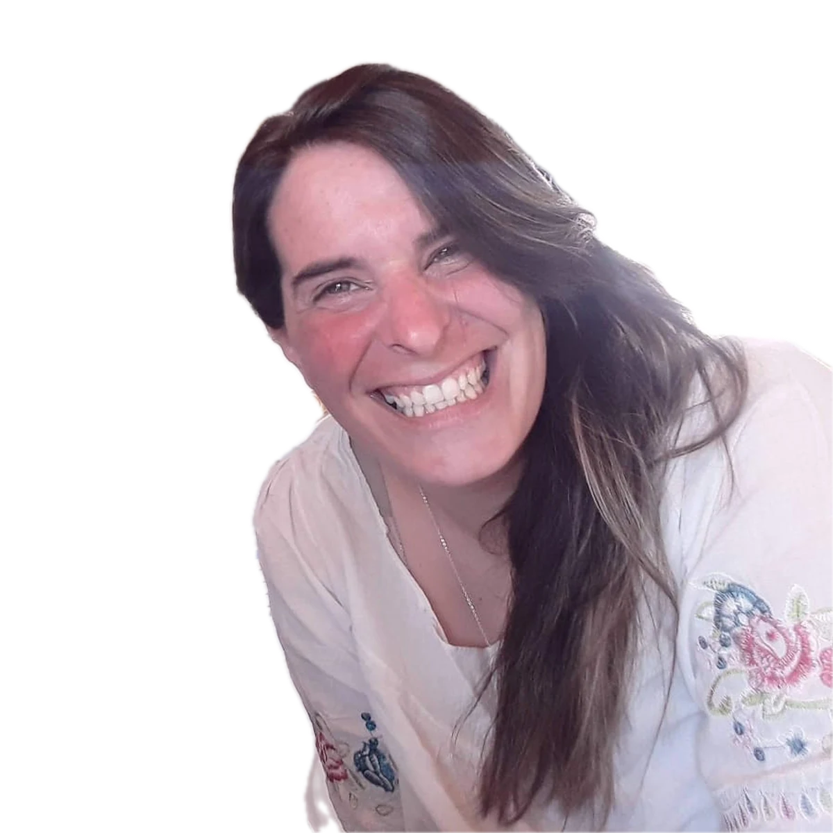 Rocio smiling in her kitchen.